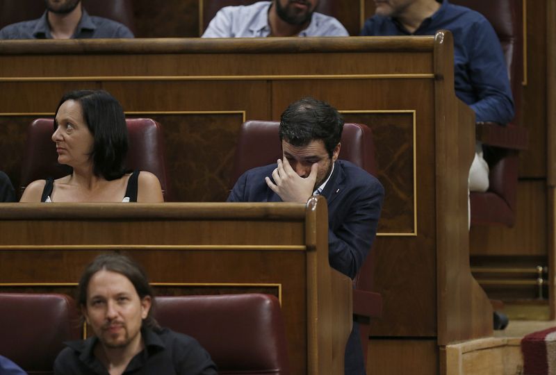 El líder de IU, Alberto Garzón, y la diputada de Podemos, Carolina Bescansa