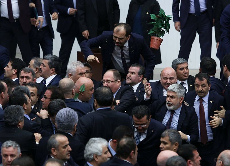 Lawmakers from ruling AK Party and the main opposition CHP scuffle during a debate on the proposed constitutional changes at the Turkish Parliament in Ankara