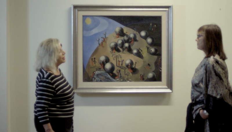 Alicia Viñas y Soledad Urabayen, ante la pintura "La Tierra", de Ángeles Santos, que está en el Museo de Figueras