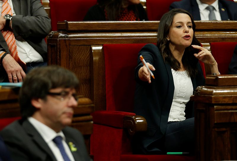 Catalan Ciudadanos leader Ines Arrimadas gestures towards Catalan President Puigdemont during a plenary session at the Catalan regional Parliament in Barcelona