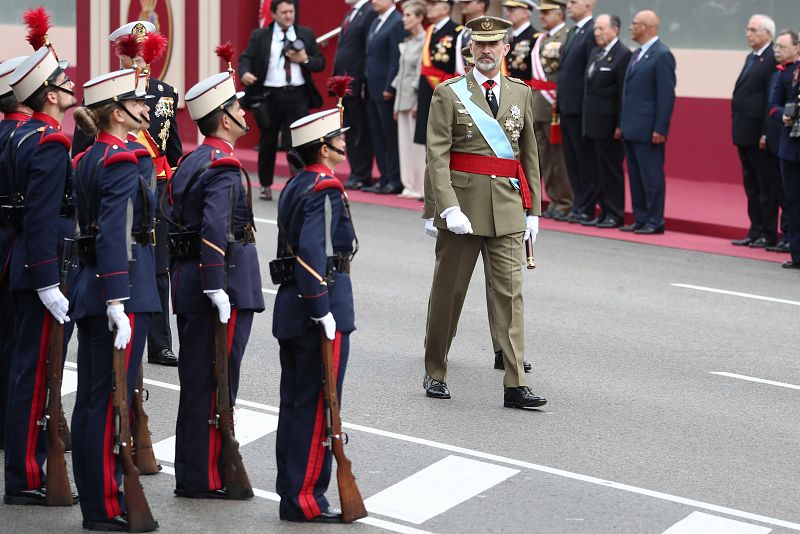Spain's King Felipe arrives to attend a parade as part of celebrations to mark Spain's National Day in Madrid