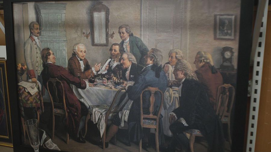 Cuadro de hombres del siglo XVIII en una sobremesa conversando.