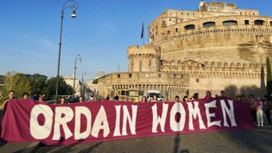 The Association of Roman Catholic Women Priests (ARCWP) behind a banner at the Vatican.