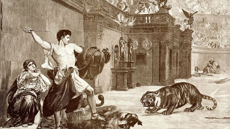 Gladiador luchando contra un tigre en el Coliseo. Una mujer observa.  Combate en tonos sepia.  Emisión Canal Europa 22/11/2024.