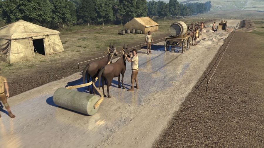 Construcción de una calzada romana: mulas con rodillo, trabajadores y carretas.  Desmiente la idea de que todas las calzadas romanas usaban grandes losas de piedra.