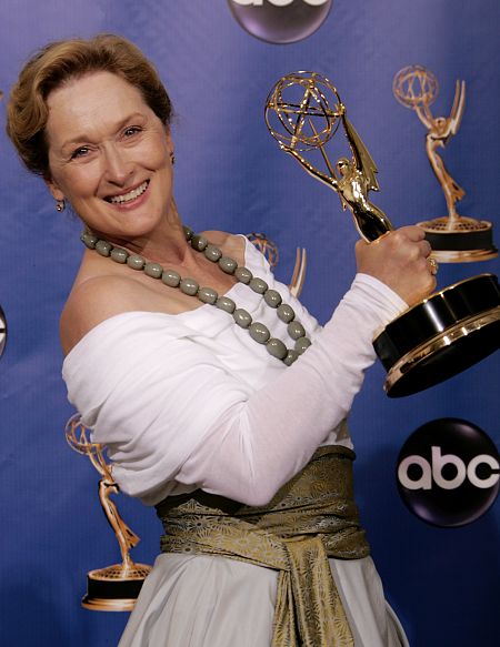 Meryl Streep poses with award backstage at the 56th annual Primetime Emmy Awards in Los Angeles.