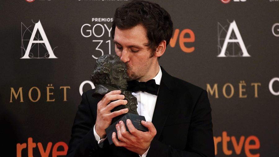 Arevalo, who won the Best New Director award, kisses his trophy during the Spanish Film Academy's Goya Awards ceremony in Madrid
