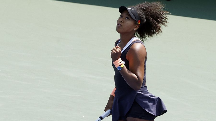 Naomi Osaka celebra un punto ante Elise Mertens.