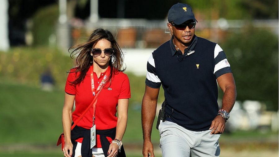 Erica Herman y Tiger Woods en un torneo