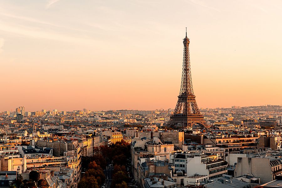 Aerial view of Paris streets and Eiffel Tower at sunset, France