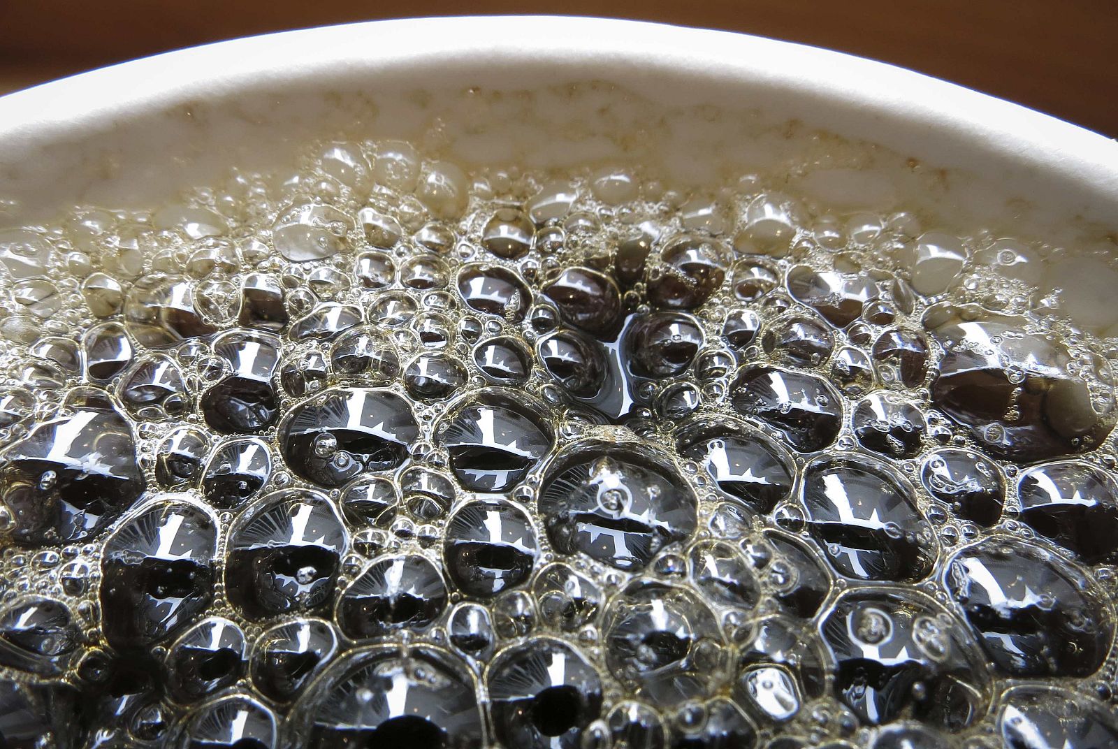 File photo of Bubbles forming on the surface of a cup of coffee in a cafe in New York