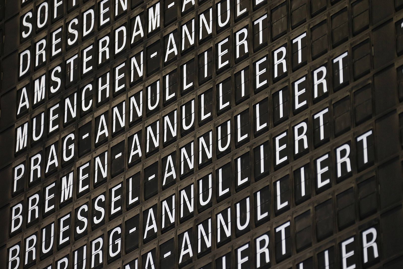 Cancelled flights of German airline Lufthansa are displayed on a flight schedule board during a strike at the Frankfurt airport, in Frankfurt
