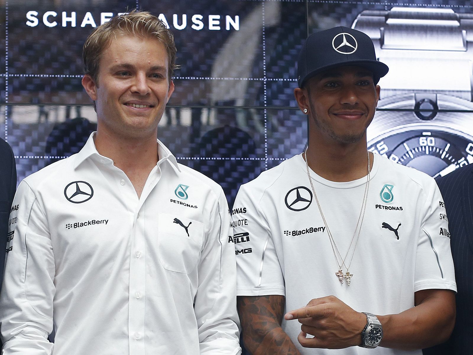 Mercedes Formula One drivers Nico Rosberg of Germany and Lewis Hamilton of Britain attend a publicity event to unveil watches that they co-designed in Singapore