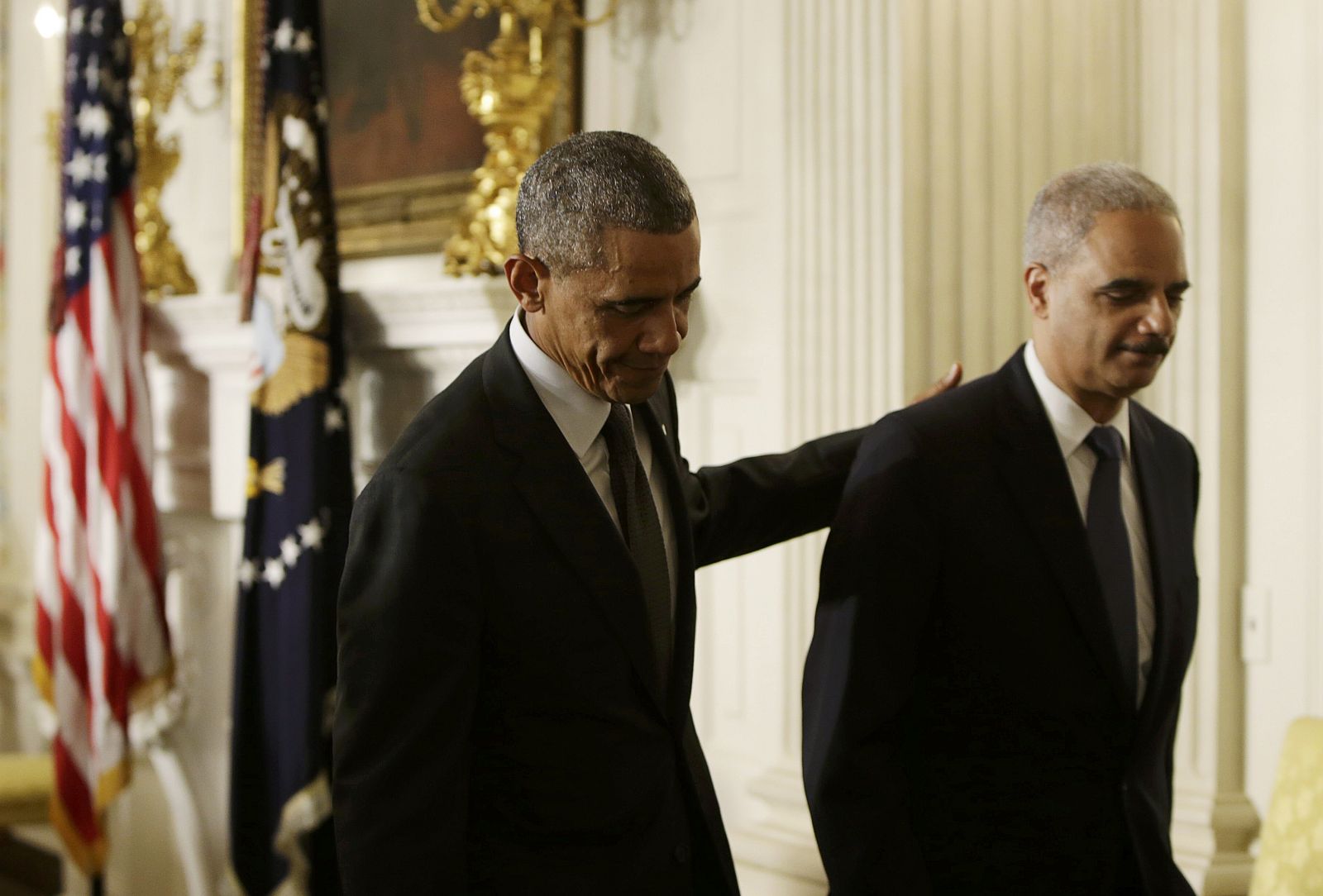 President Obama and U.S. Attorney General Holder depart together after announcing Holder's resignation at the White House in Washington
