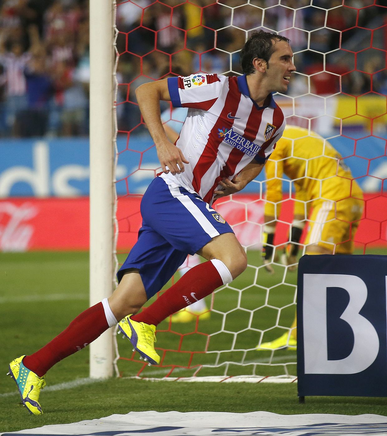 Atletico Madrid's Diego Godin celebrates his goal against Celta Vigo during their Spanish first division soccer match at Vicente Calderon stadium in Madrid