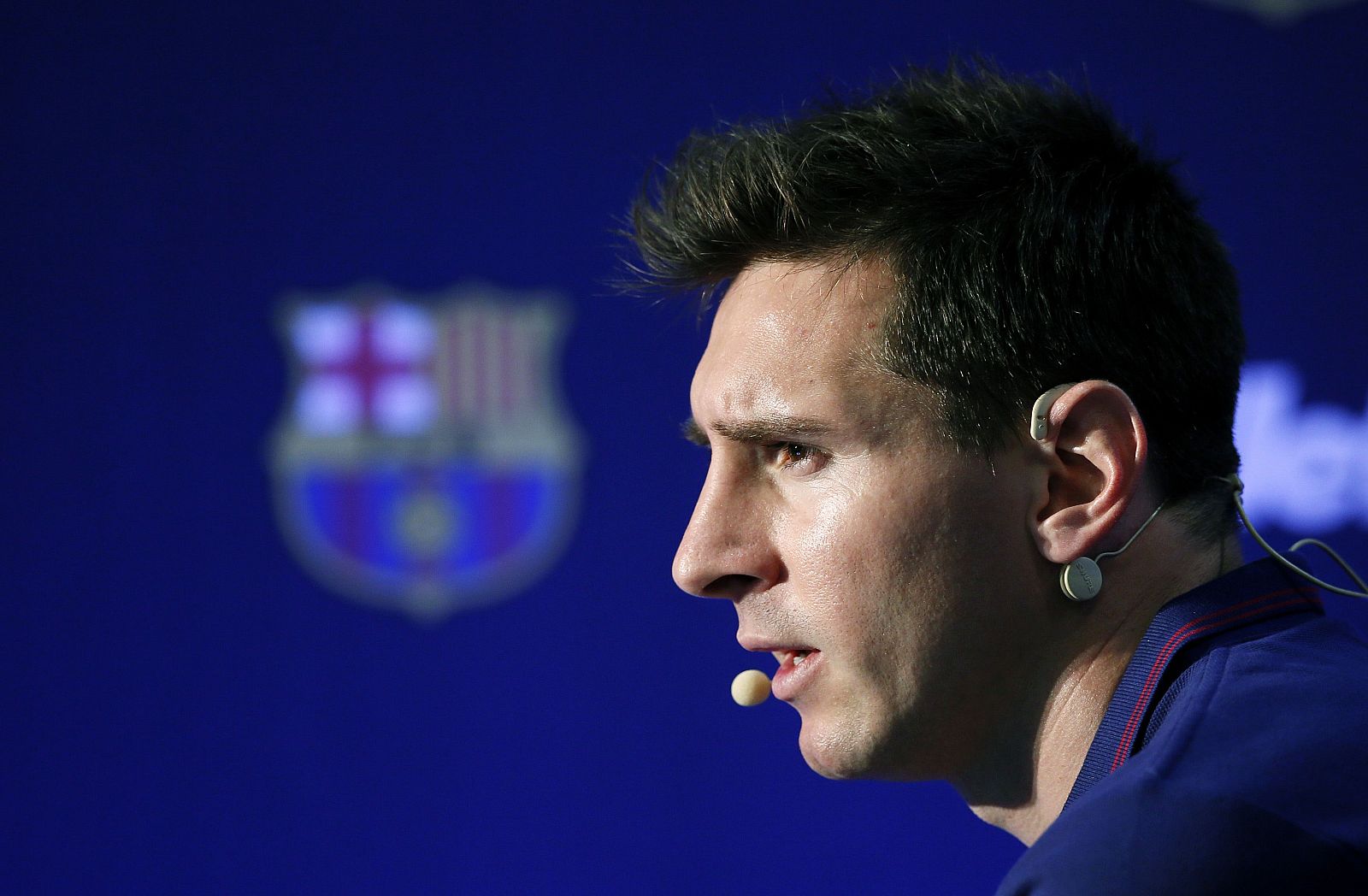 Barcelona's soccer player Lionel Messi of Argentina attends a news conference during a commercial event at Camp Nou stadium in Barcelona