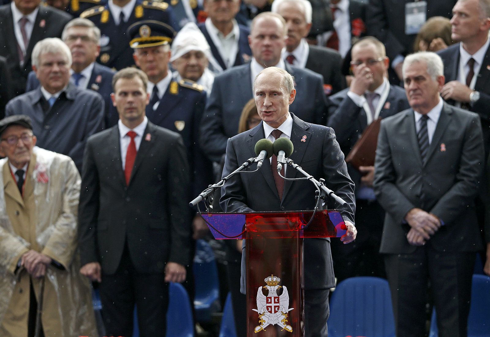 Russian President Putin addresses during a military parade to mark 70 years since the city's liberation by the Red Army as Serbian President Nikolic looks on in Belgrade