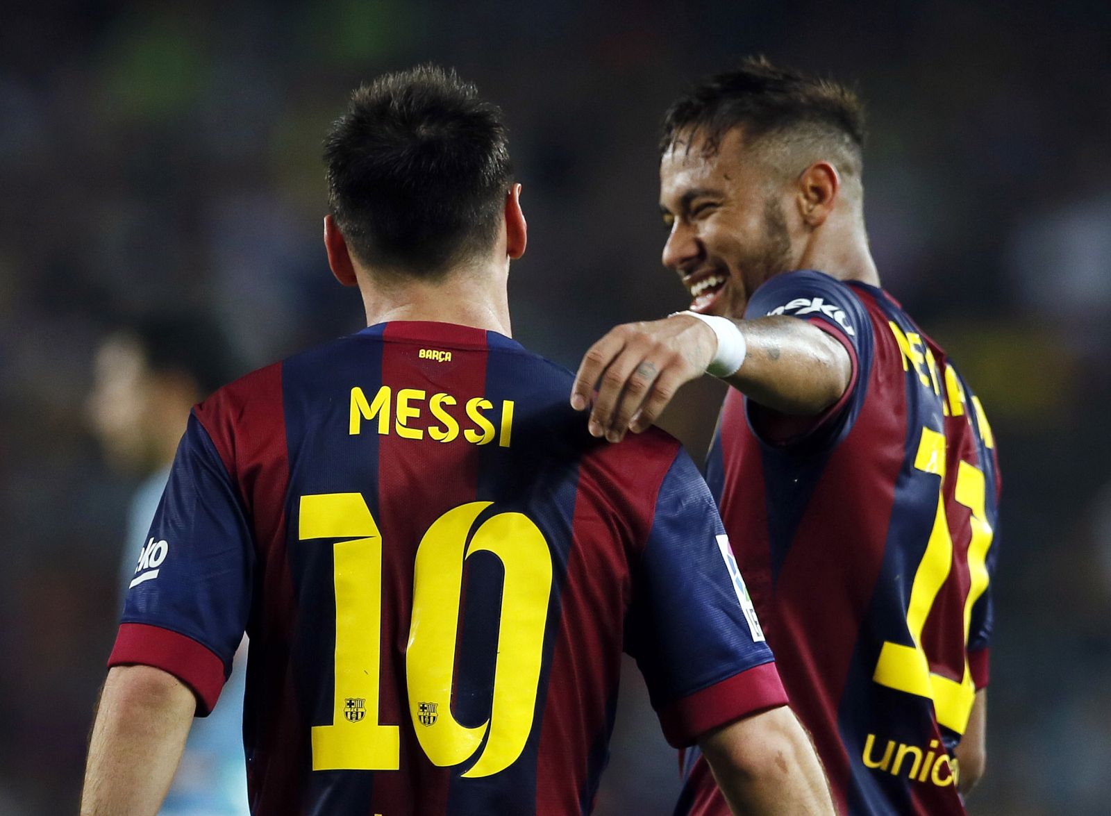 Barcelona's Messi and Neymar celebrate a goal against Eibar during their Spanish first division soccer match at Camp Nou stadium in Barcelona