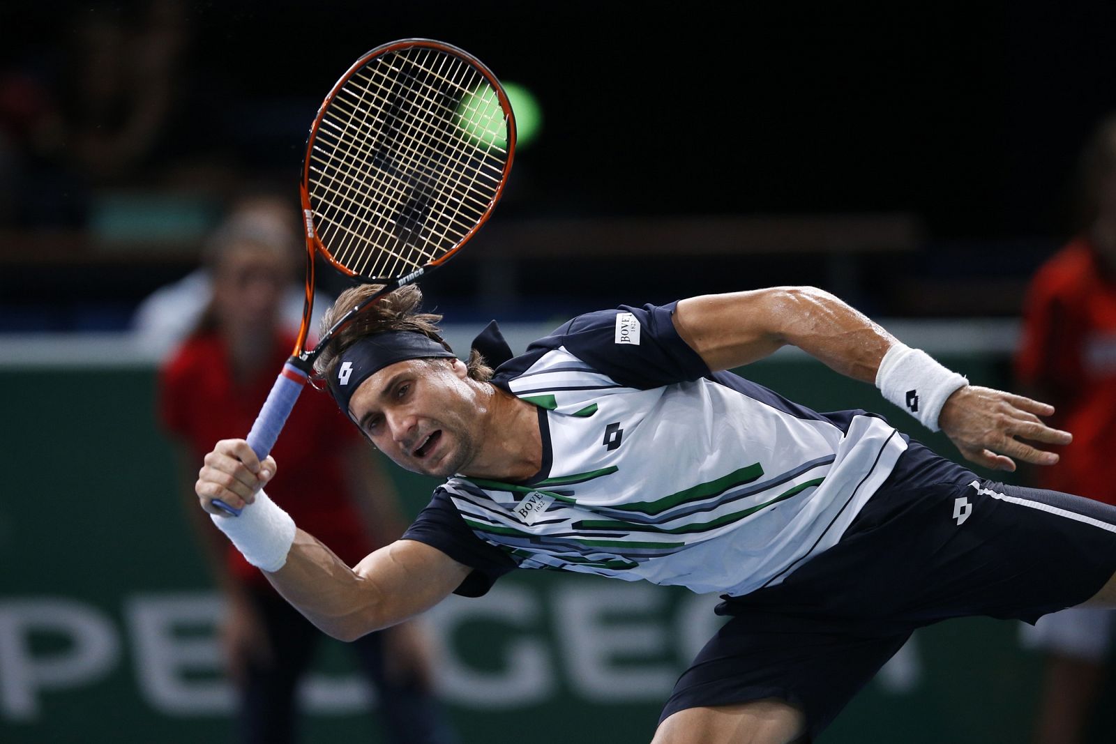 Ferrer of Spain returns a shot during his men's singles quarter-final tennis match against Nishikori of Japan at the Paris Masters tennis tournament at the Bercy sports hall in Paris
