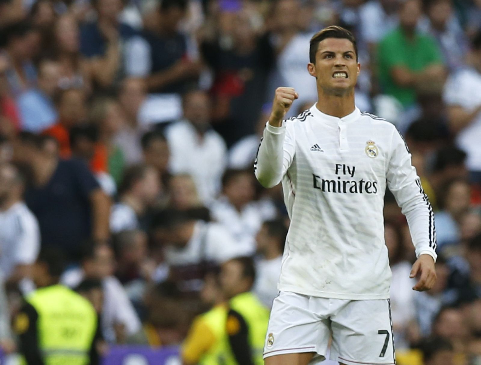 Real Madrid's Ronaldo celebrates after scoring with a penalty kick against Barcelona during their Spanish first division "Clasico" soccer match at the Santiago Bernabeu stadium in Madrid