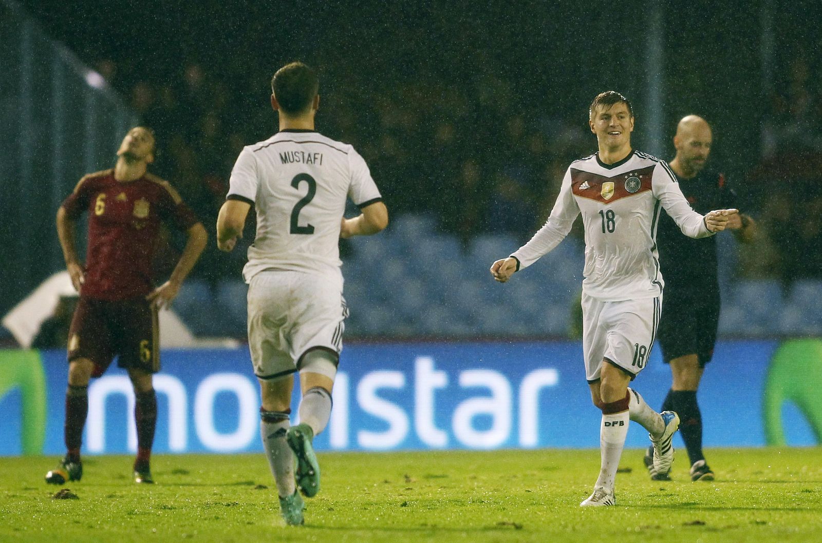 Germany's Kroos celebrates his goal against Spain with his teammate Mustafi during international friendly soccer match at Balaidos stadium in Vigo