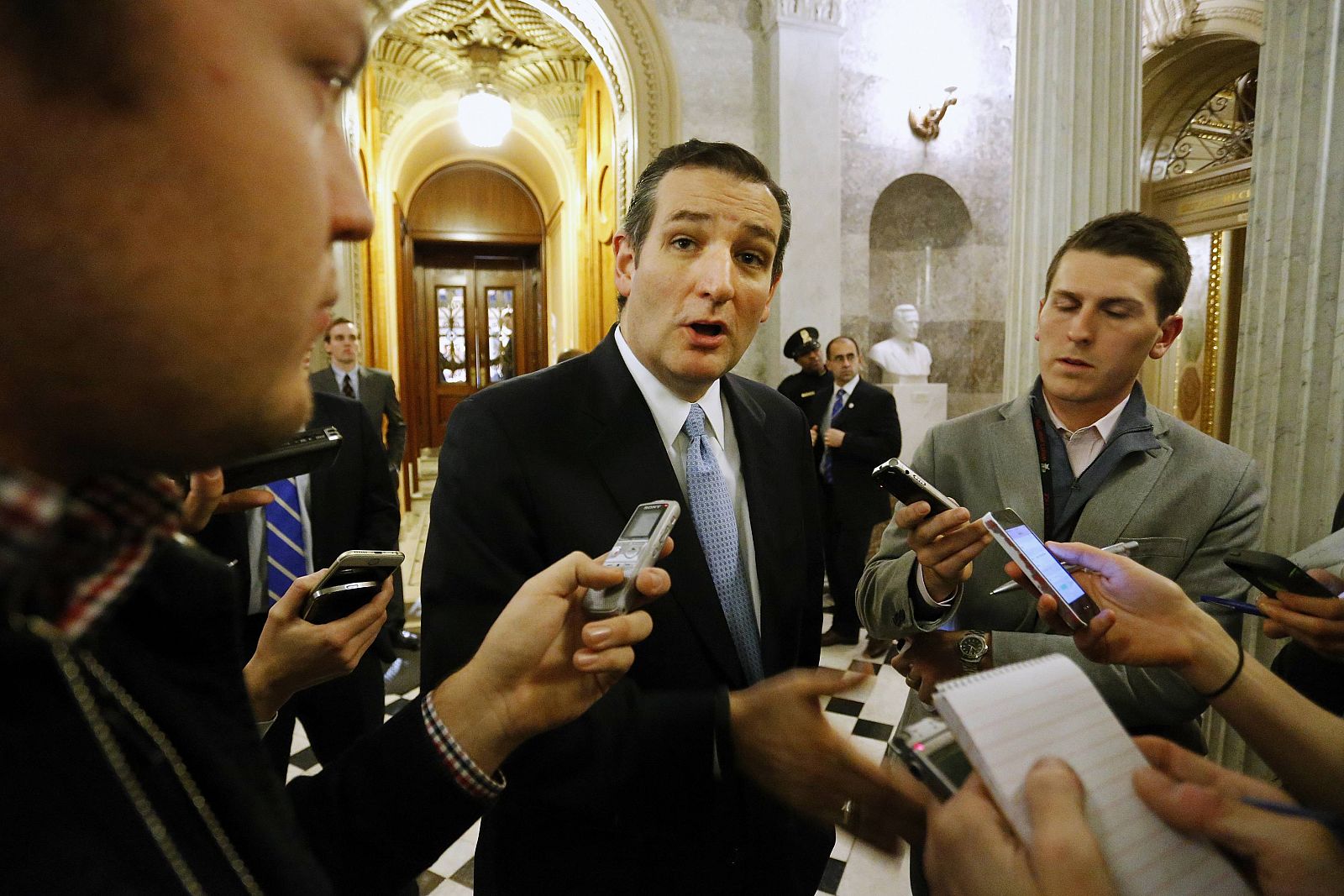 U.S. Senator Ted Cruz talks to reporters after the Senate passed a $1.1 trillion spending bill at the U.S. Capitol in Washington