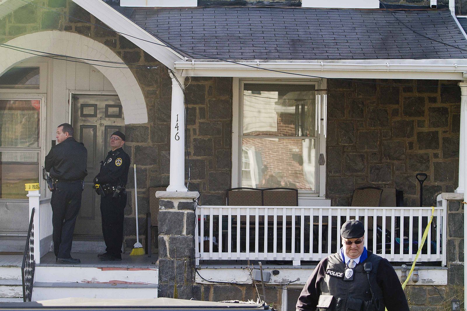Police search outside a home in a suburb of Philadelphia where a suspect in five killings was believed to be barricaded in Souderton Pennsylvania