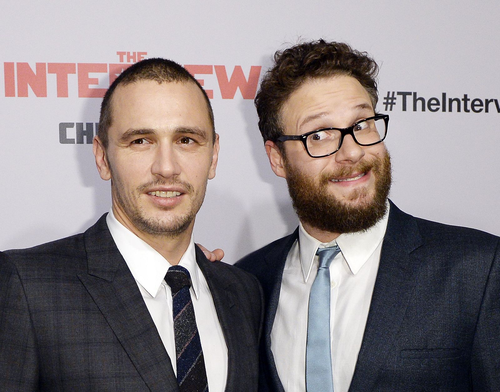 Cast members Franco and Rogen pose during premiere of the film "The Interview" in Los Angeles