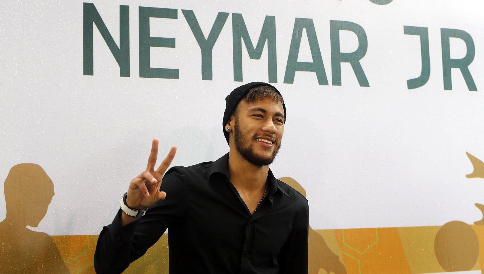 Neymar poses for media as he opens the Neymar Project Institute in Santos