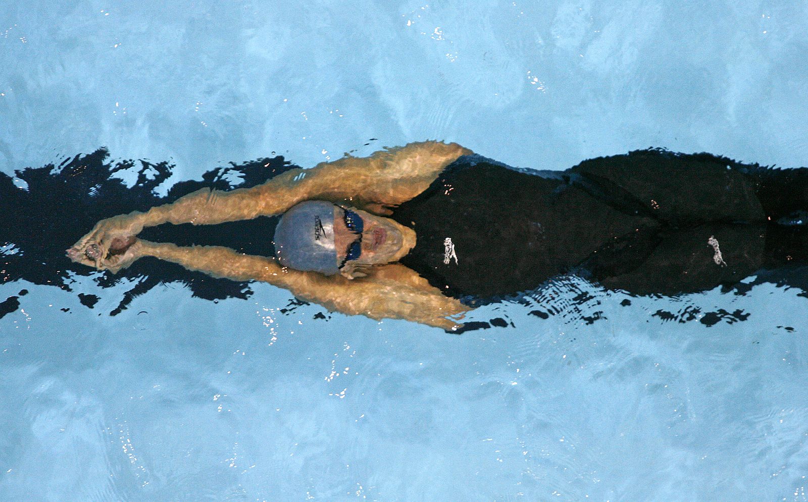 Natalie Coughlin paró el reloj en 58.97, seis centésimas menos que la anterior marca