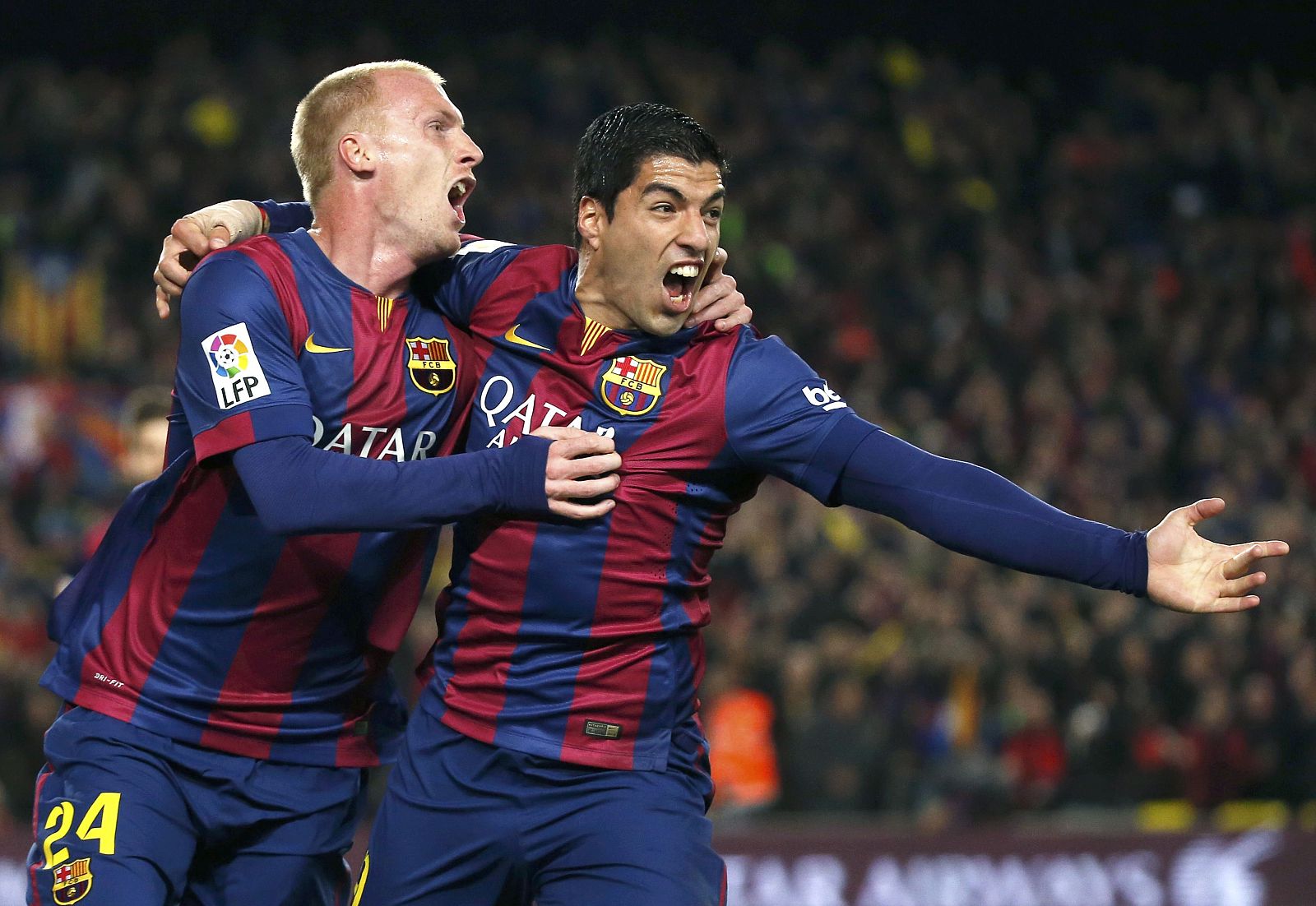 Barcelona's Mathieu celebrates his goal against Real Madrid with his team mate Suarez during their Spanish first division "Clasico" soccer match at Camp Nou stadium in Barcelona