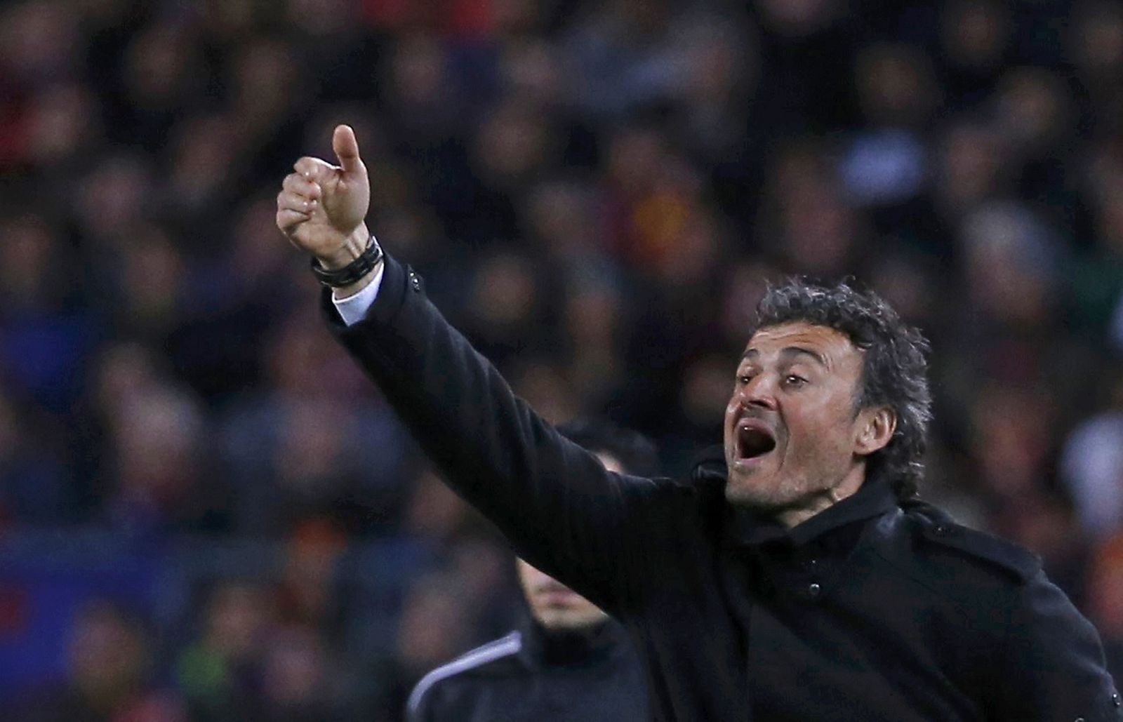 Barcelona's coach Enrique reacts during their Spanish first division "Clasico" soccer match against  Real Madrid at Camp Nou stadium in Barcelona