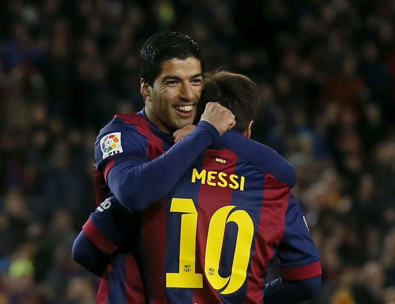 Barcelona's Lionel Messi and Luis Suarez celebrate a goal against Almeria during their Spanish first division soccer match at Camp Nou stadium in Barcelona