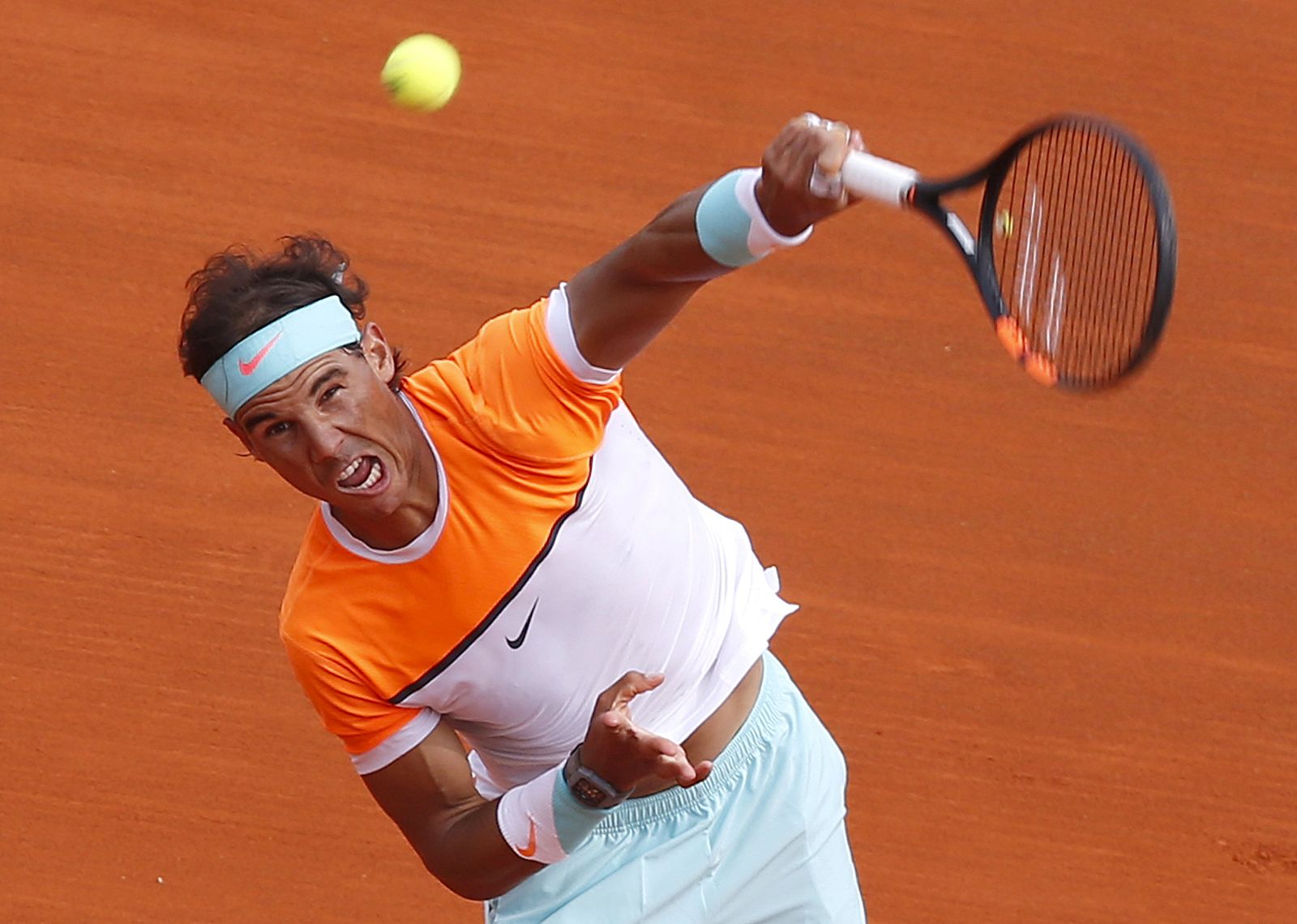 Nadal of Spain serves during his men's singles semi-final tennis match against Djokovic of Serbia at the Monte Carlo Masters in Monaco