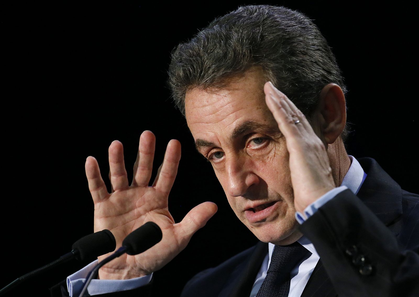File picture shows former French president and current UMP conservative political party head Sarkozy as he attends a political rally in the Essonne department as he campaigns for French departmental elections in Palaiseau