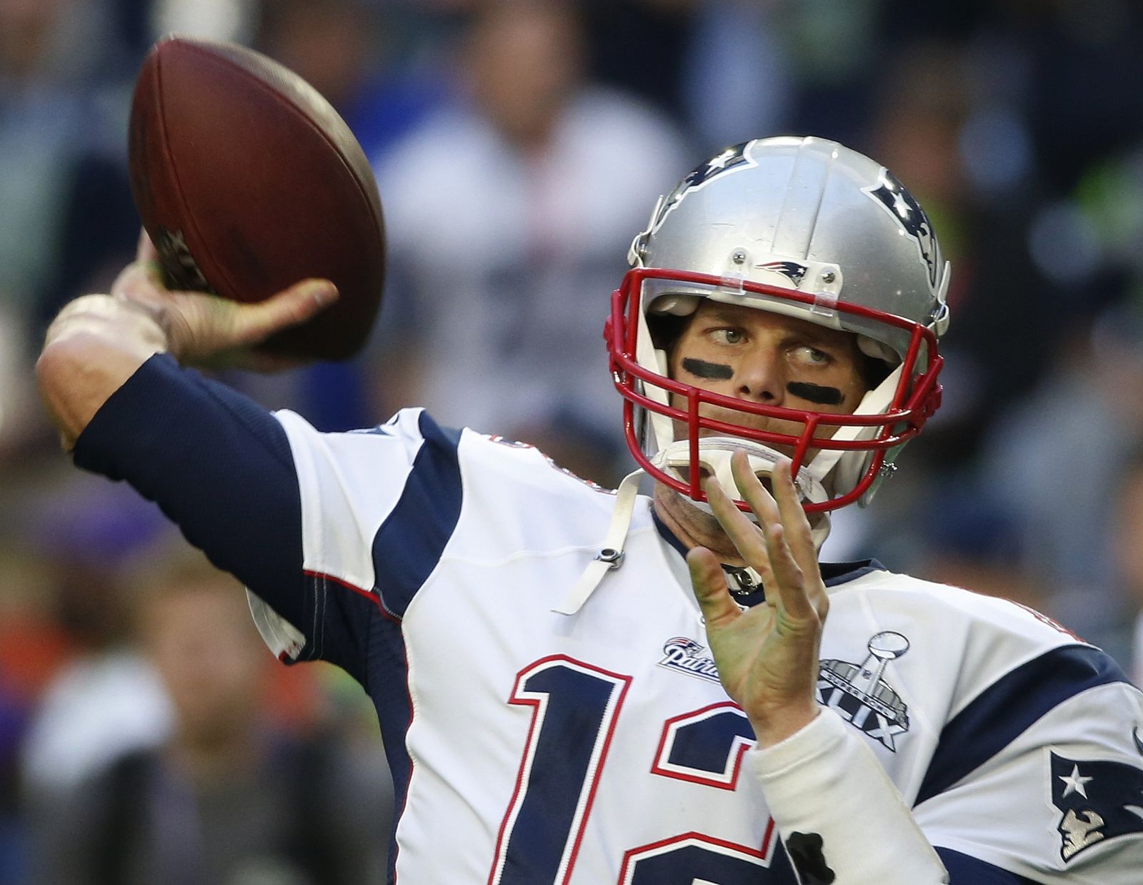 New England Patriots quarterback Tom Brady warms-up ahead of the start of the NFL Super Bowl XLIX football game against the Seattle Seahawks in Glendale
