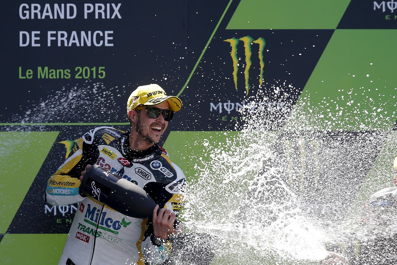 Winner Kalex Moto2 rider Luthi of Switzerland sprays champagne on the podium after the French Grand Prix at the Le Mans circuit, in Le Mans, France