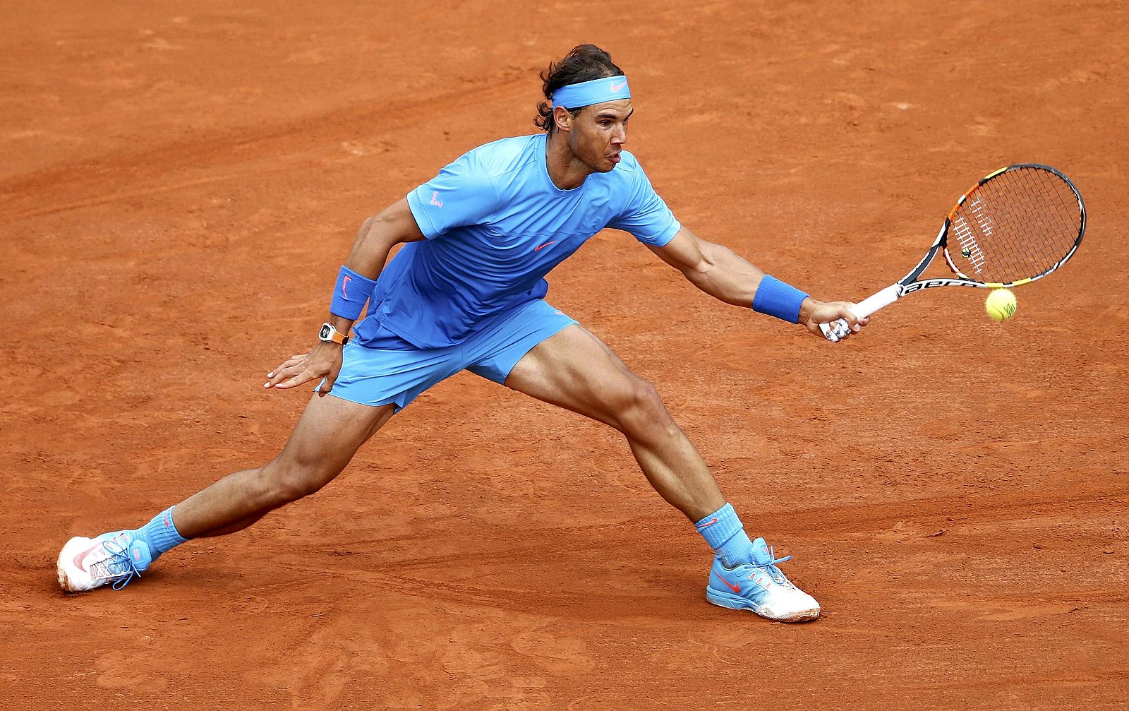 Rafael Nadal of Spain plays a shot to compatriot Nicolas Almagro during their men's singles match at the French Open tennis tournament at the Roland Garros stadium in Paris
