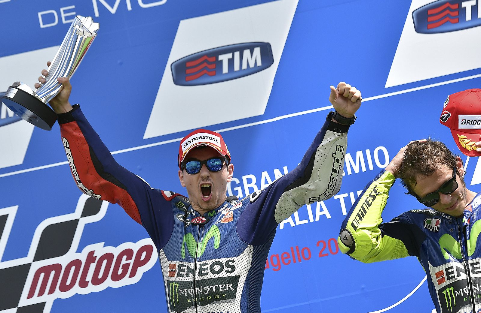Yamaha MotoGP rider Lorenzo of Spain celebrates on the podium next to his teammate Rossi of Italy after the Italian Grand Prix at the Mugello circuit