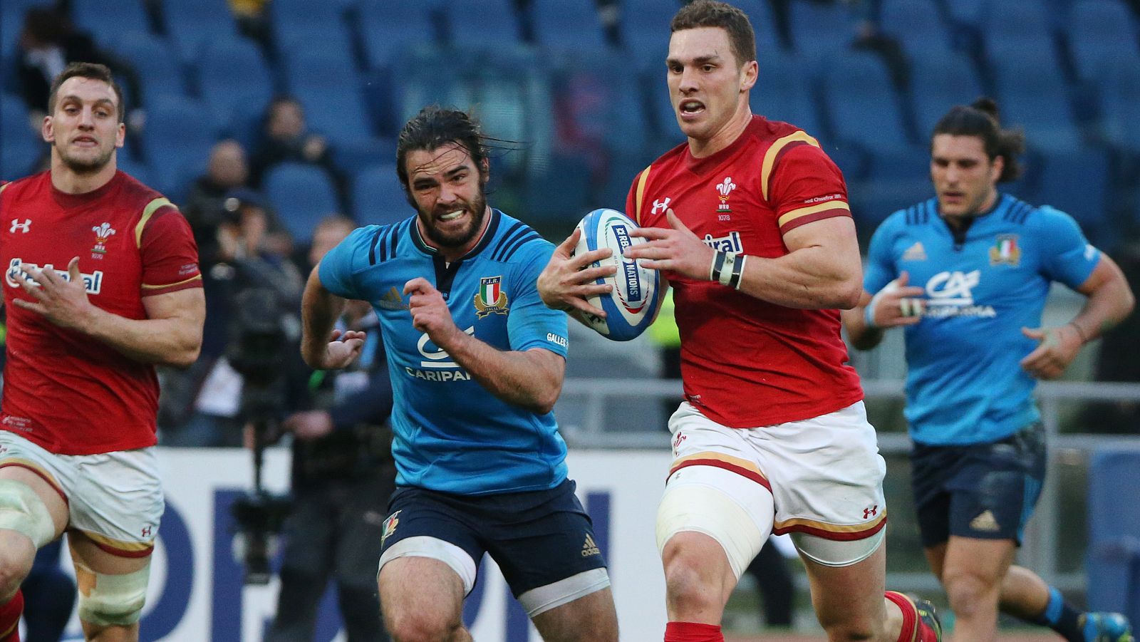Wales' George North runs in to score a try
