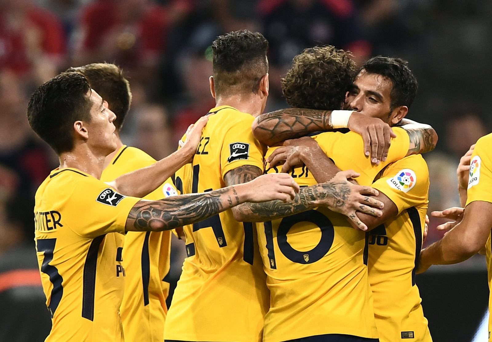 Los jugadores del Atlético celebran el gol en la final de la Copa Audi.