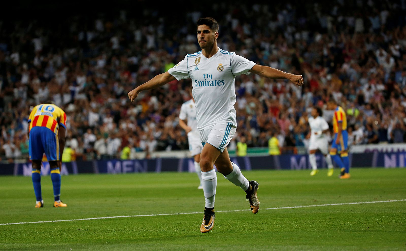 Marco Asensio celebra su primer gol ante el Valencia