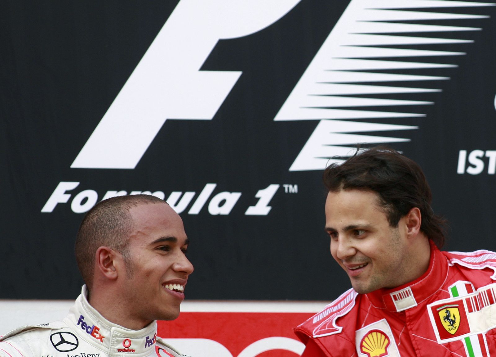 Ferrari's Formula One driver Massa and McLaren's Hamilton talk on the podium after the Turkish F1 Grand Prix in Istanbul Park