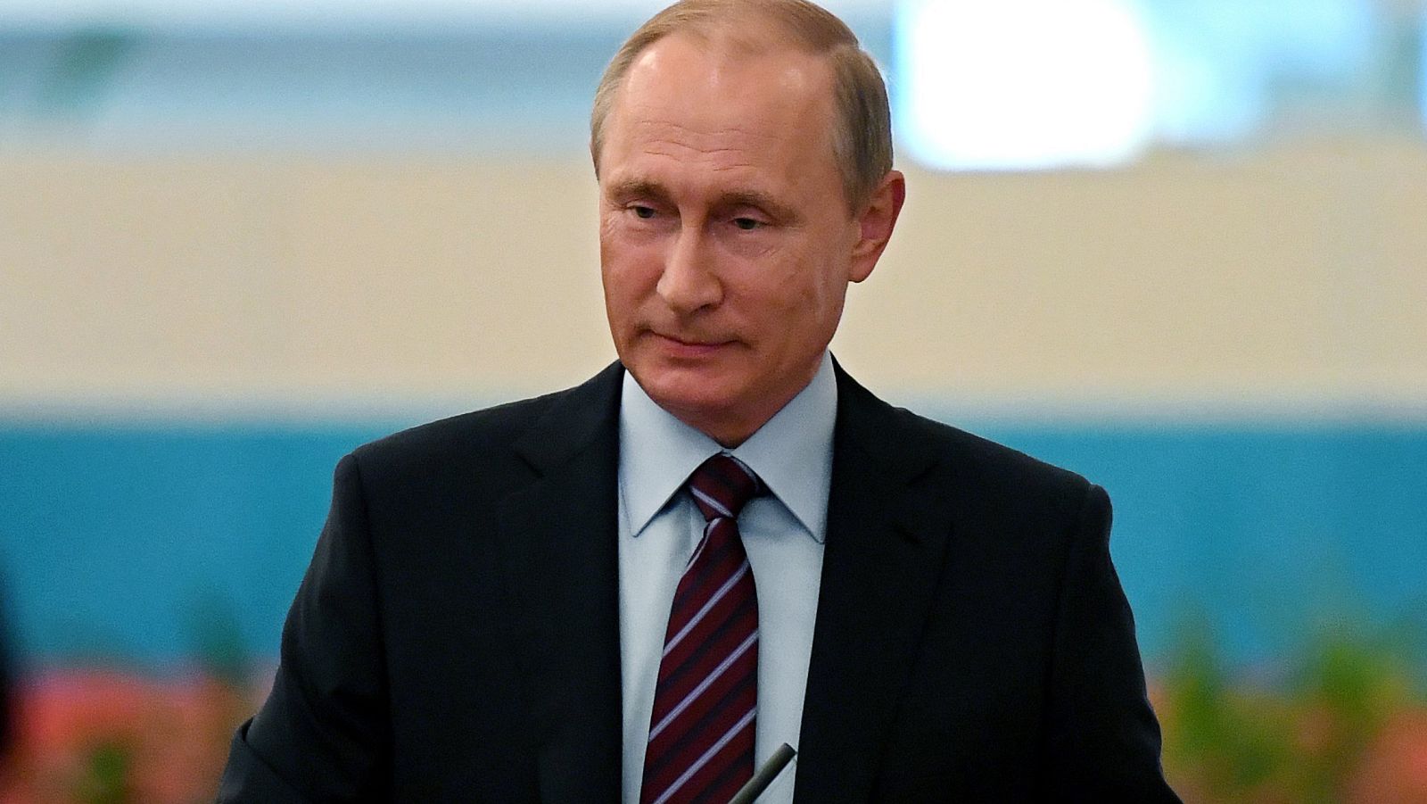 Russian President Vladimir Putin votes on single election day