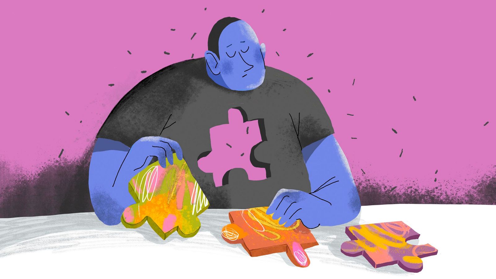 Una persona con piel azul y expresión de tristeza, vestida con una camiseta gris oscura con un hueco en forma de pieza de puzzle rosa, se encuentra frente a piezas de puzzle de colores sobre una superficie blanca.