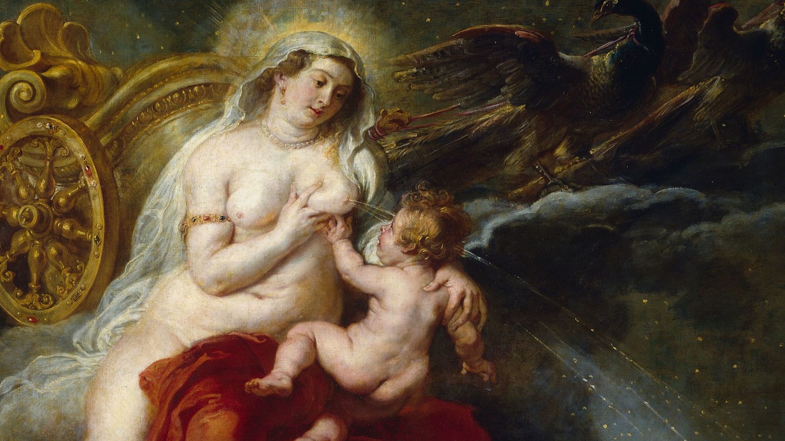 En la obra "Vía Láctea", una mujer con el torso descubierto y cubierta por un velo, alimenta a un bebé. La escena se desarrolla en un carro dorado, con un pavo real presente y un fondo estrellado, mostrando un estilo barroco.