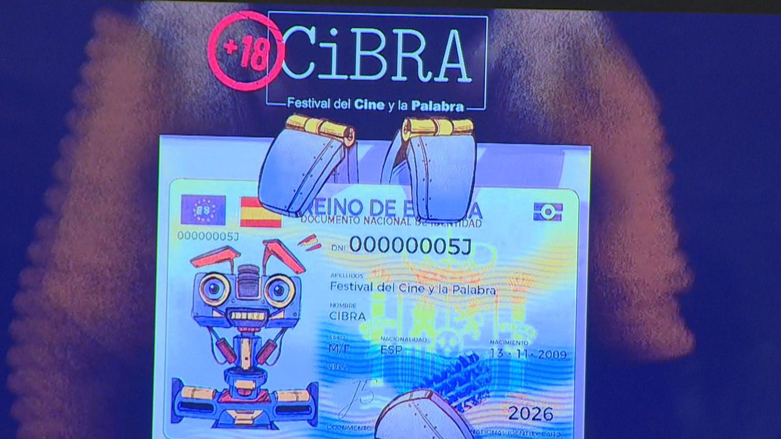 Cartel promocional del festival CiBRA con diseño inspirado en un DNI español, que incluye un robot ilustrado en el espacio de la fotografía y detalles cinematográficos.