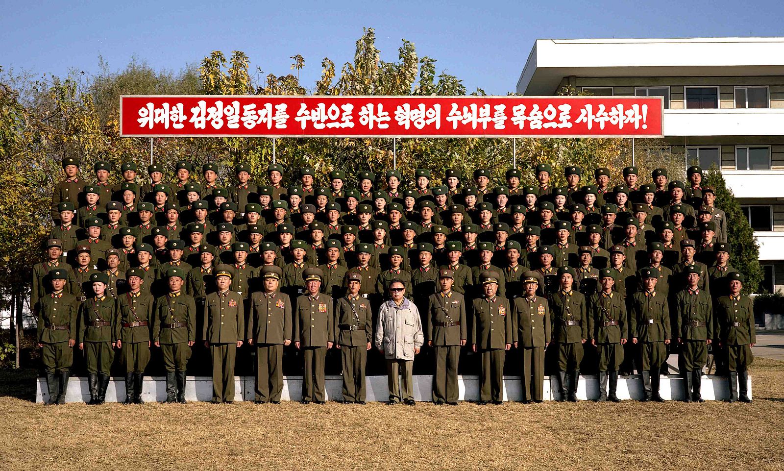 Supreme Commander of the North Korean People's Army poses with soldiers at an undisclosed location in North Korea