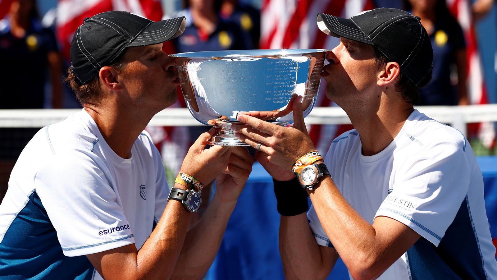 FILE PHOTO: Bob and Mike Bryan of the U.S. kiss their trophy after they defeated Granollers and Lopez of Spain in their men's doubles final match at the 2014 U.S. Open tennis tournament in New York