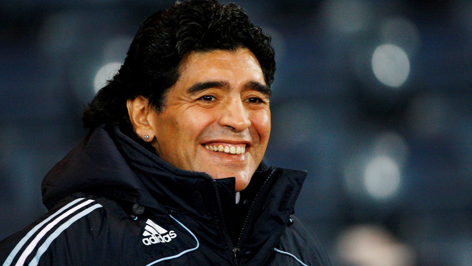 FILE PHOTO: Argentina's soccer team head coach Maradona smiles during their international friendly soccer match against Scotland in Glasgow, Scotland